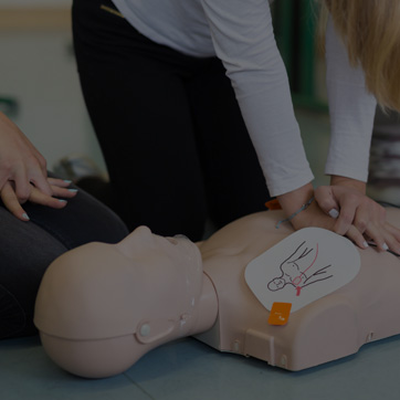 A photograph showing CPR being demonstrated on a dummy